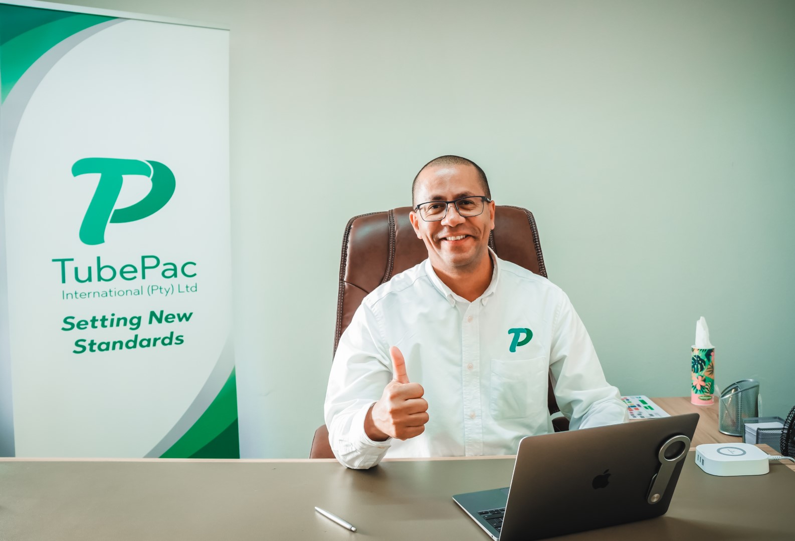 MD of TubePac International, Glenton Pick at his desk